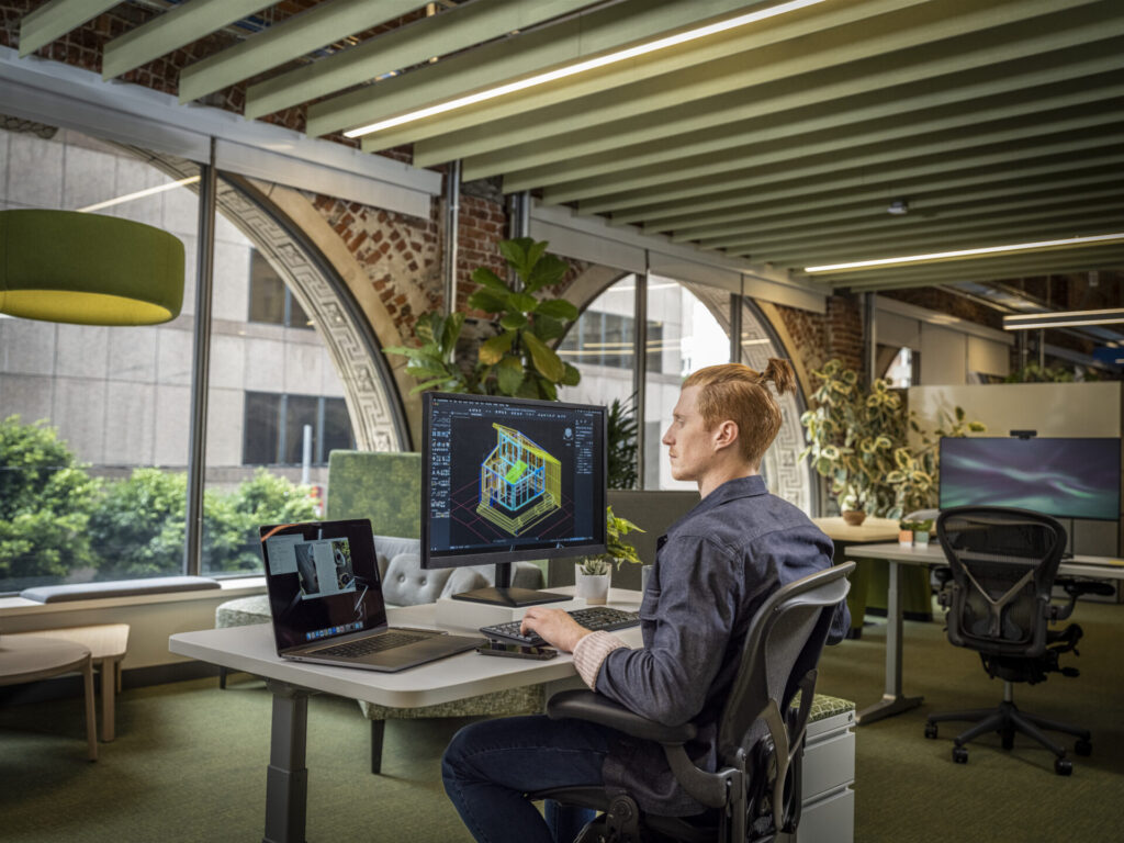 Man working with AutoCAD in office