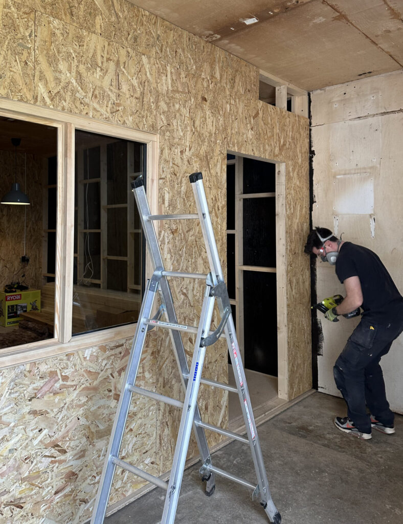 Figure 8 – External OSB sheets being nailed to the vertical timbers