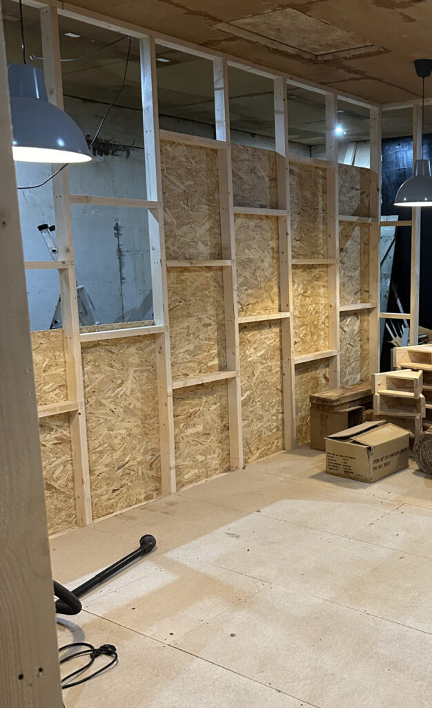 Figure 6 – The timber framing before and after the insulation and interior OSB was added