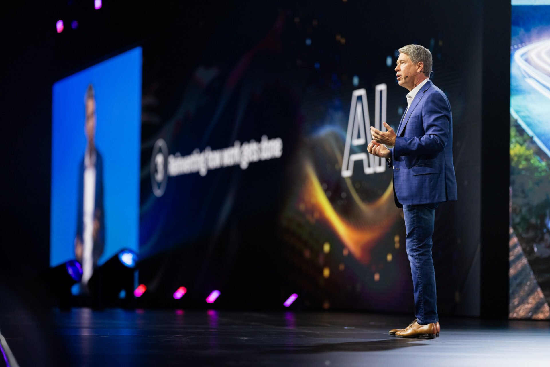 speaker on stage at autodesk university