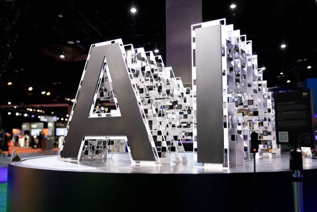 A physical installation of the letters AI on exhibit at Autodesk University