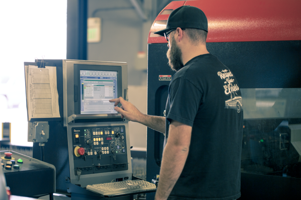 CNC operator programming at machine CAM